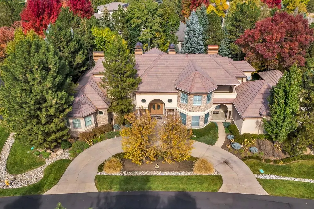 Aerial view of an estate among fall color at 3 Wildrose Trail in Cherry Hills Village, one of our past sales