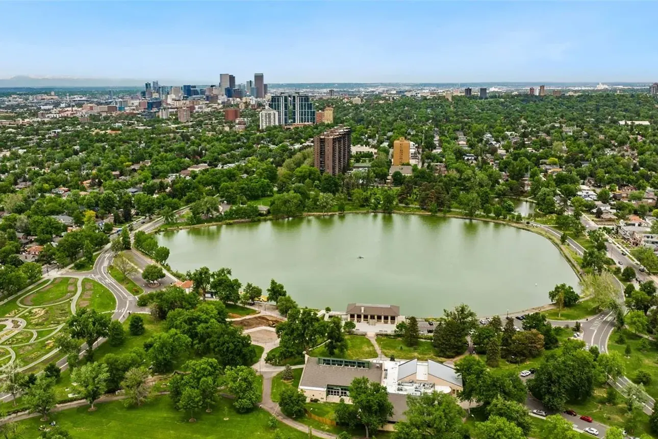 Aerial view over Washington Park and its lake, looking north to downtown Denver